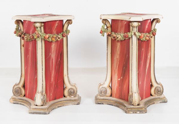 Pair of quadrangular centre bases, in lacquered wood and decorated with fake marble with fruit garlands in relief