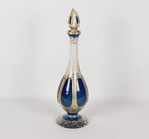 Antique French bottle in cobalt blue crystal with pure gold decorations. The cap and the base have cracks and missing parts