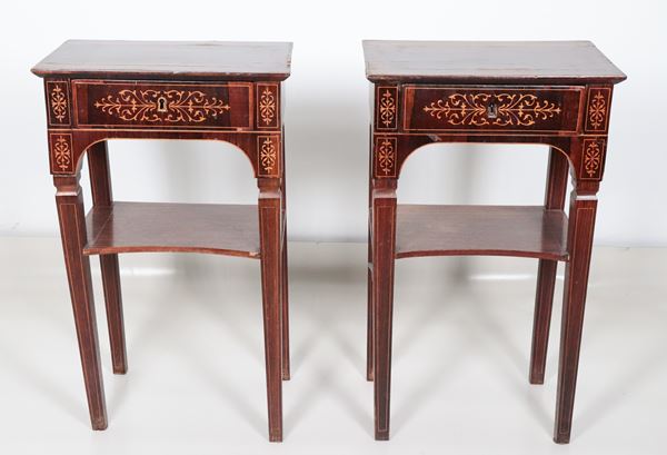 Pair of antique Charles X style mahogany coffee tables, with neoclassical motif inlays, a central drawer and four legs joined by a small shelf underneath