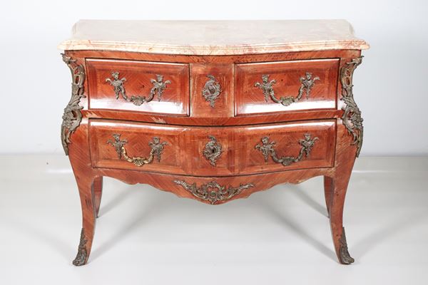 French Napoleon III chest of drawers with a curved shape, in mahogany, rosewood and purple ebony, with inlays with fillets and seals and handles in gilded and chiselled bronze, three drawers and a top in brecciated marble