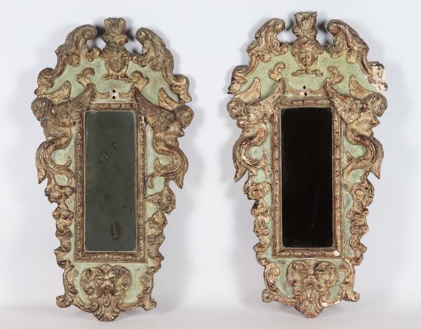 Pair of small mirrors in gilded wood and green lacquer, entirely carved with Louis XV motifs, mercury mirrors. Some missing parts