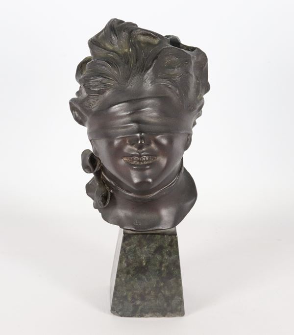 Vincenzo Aurisicchio - Firmato. "Dea bendata", piccolo busto in bronzo, sorretto da base in marmo verde delle Alpi