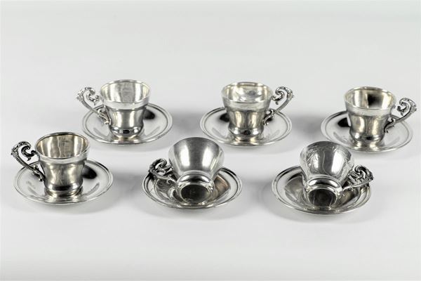Set of six silver cups with saucers