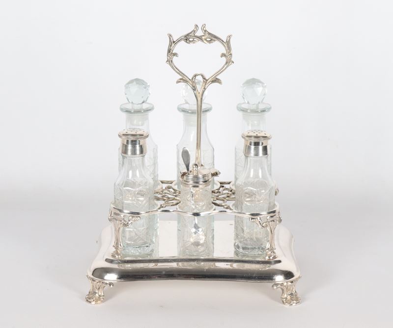 Cruet inglese in sheffield sbalzato con sei flaconi in cristallo