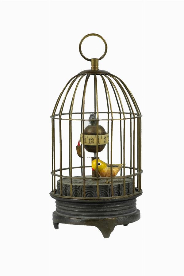 Cage with bird and clock