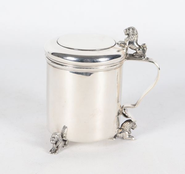 Small silver metal mug with small lion sculptures