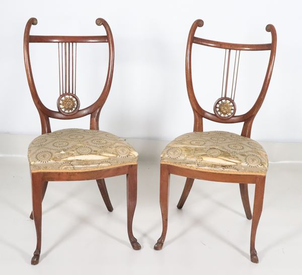 Pair of walnut chairs with lyre-shaped backrests