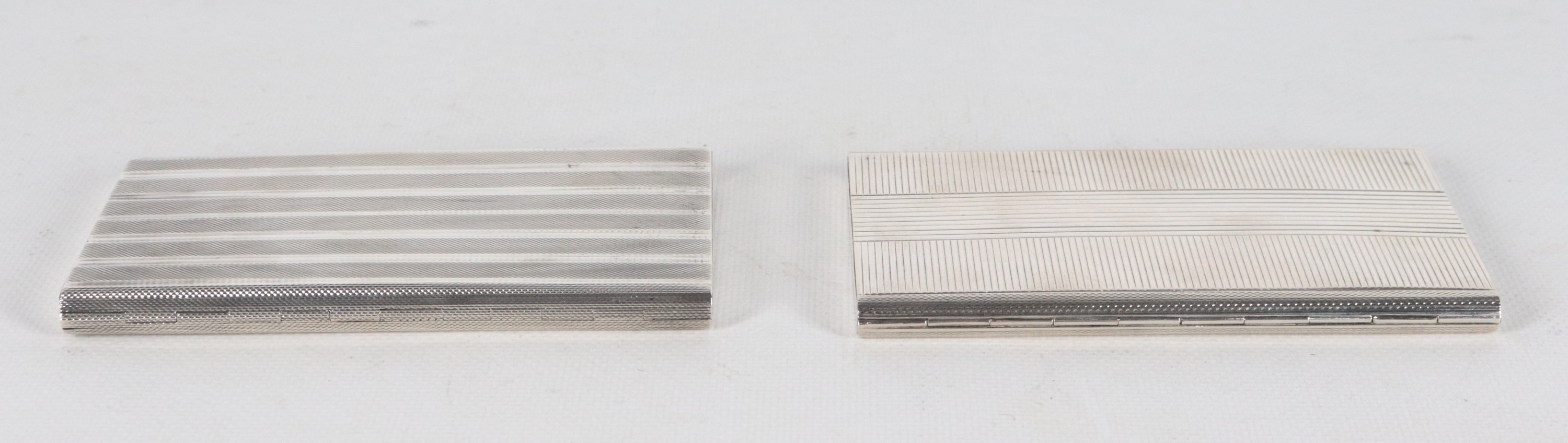 Lotto di due portasigarette in argento guillochè, gr. 335