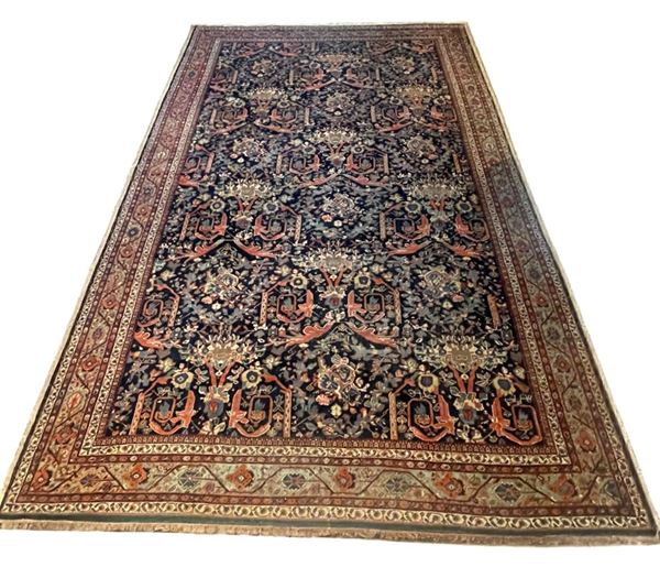 Tappeto persiano Farahan a disegni floreali, geometrici e arabesque su fondo blu M. 5 x 3,30