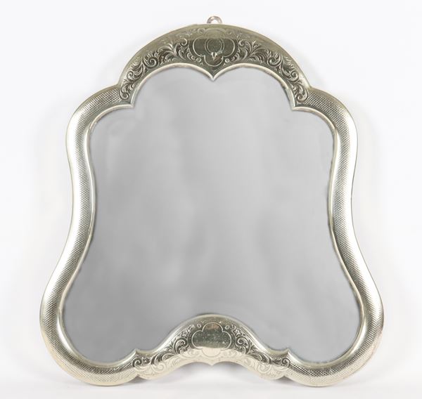 Antique mirror in chiseled and embossed silver metal