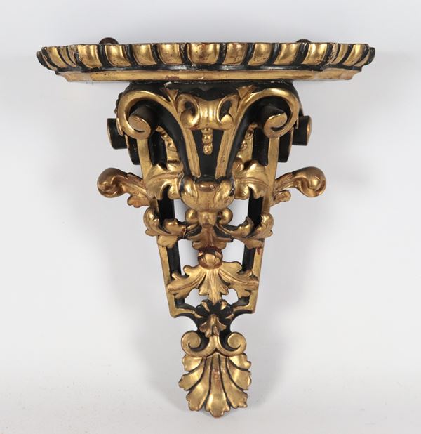 Antique wall shelf in patinated and gilded wood carved with Louis XV motifs
