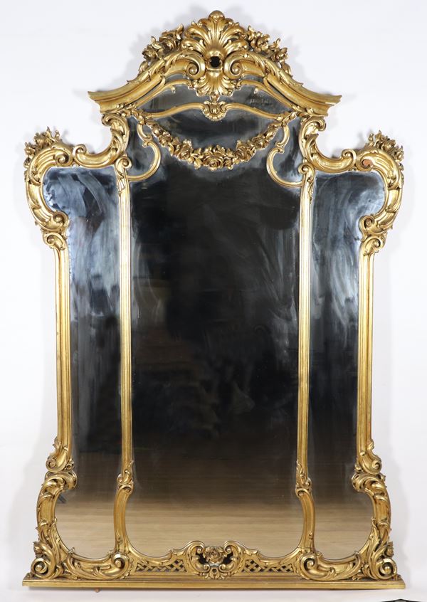 Large French mirror in gilded wood and carved with Louis XV motifs