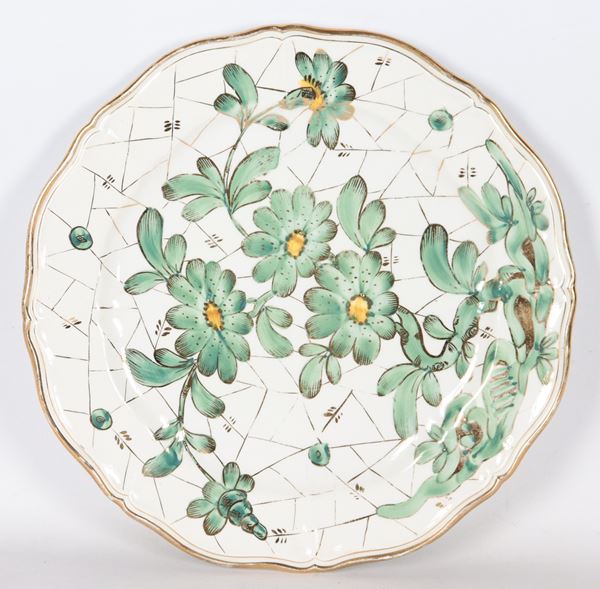 Porcelain ceramic wall plate with green floral decorations