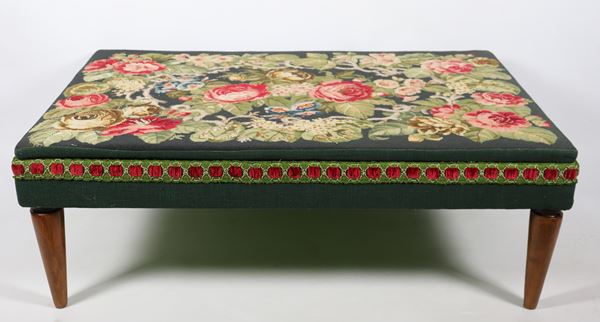Large wooden pouf with floral patterned small stitch fabric cover