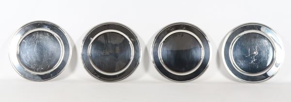 Lot of four silver metal serving plates