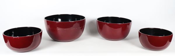 Lot of four round bowls of various sizes in red and black lacquered wood