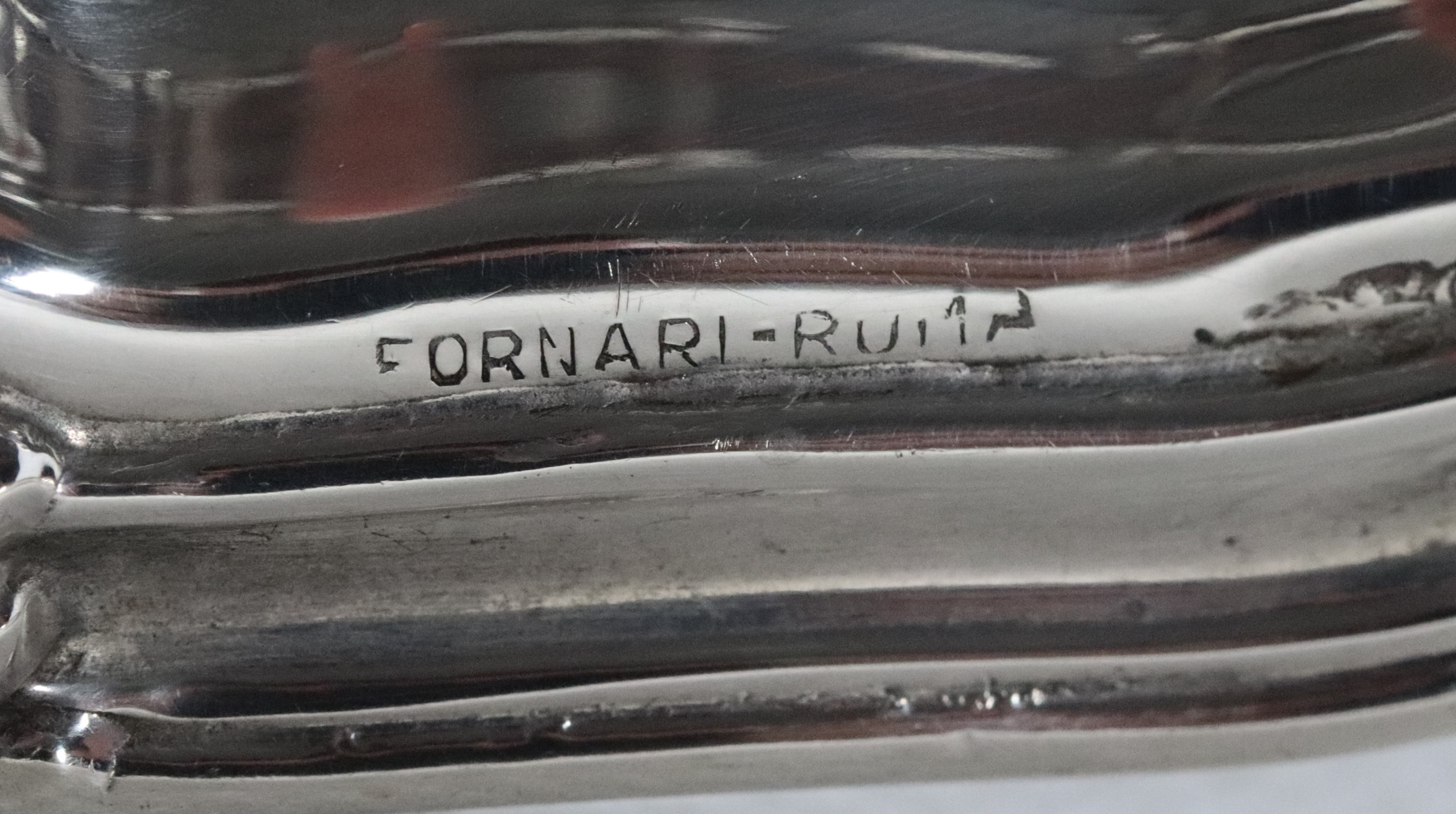 Lotto di dodici sottobicchieri in argento con bordi centinati, gr. 735