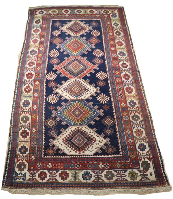 Tappeto persiano Shirvan a disegno geometrico su fondo blu