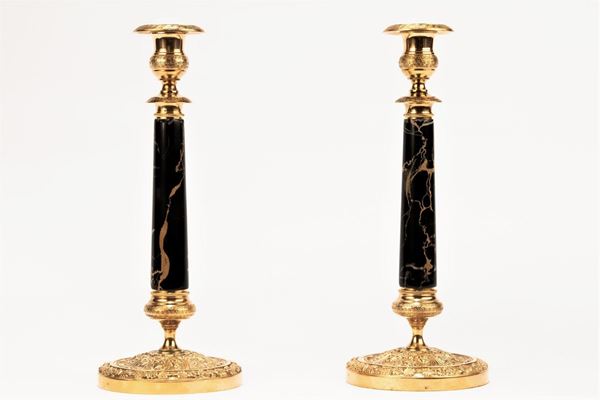 Pair of Charles X candlesticks in gilded bronze