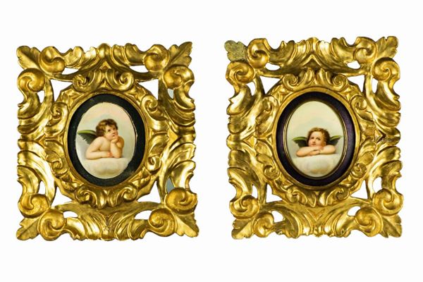 Pair of &quot;Amorini&quot; polychrome porcelain plaques