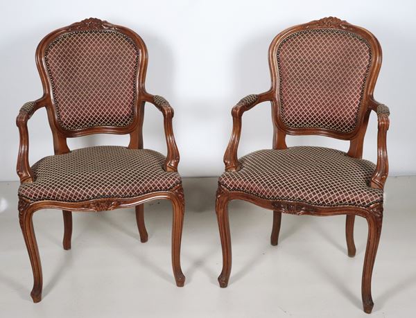 Pair of Louis XV walnut armchairs, covered in burgundy fabric with a geometric design