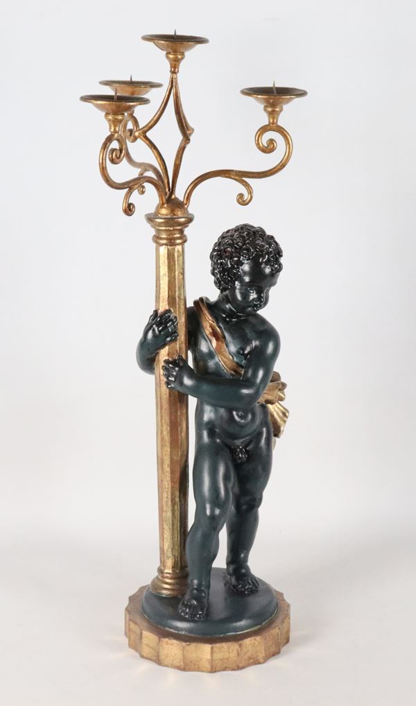 Candelabra with sculpture of "Putto" in carved, gilded and black lacquered wood, 4 flames