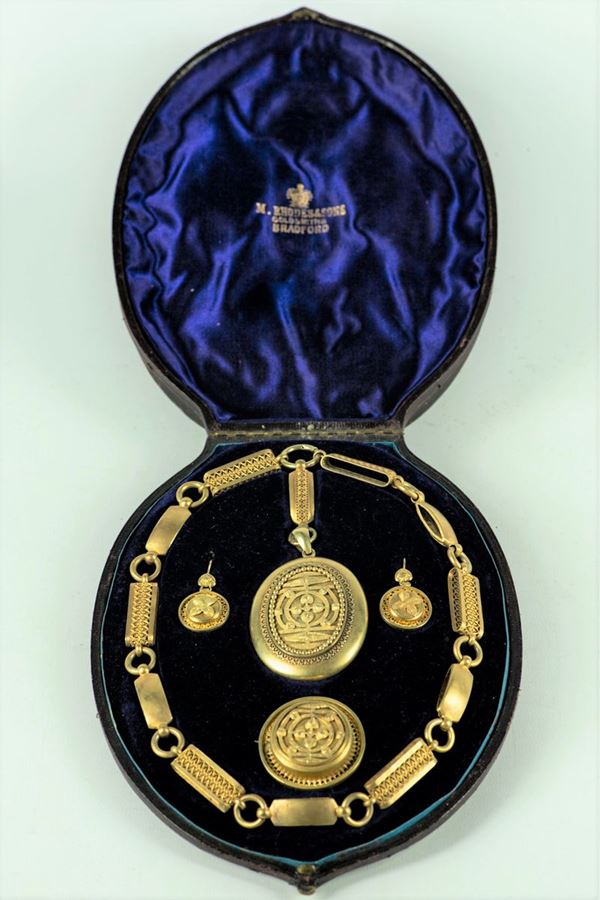 Parure Epoca Regina Vittoria in argento dorato e cesellato