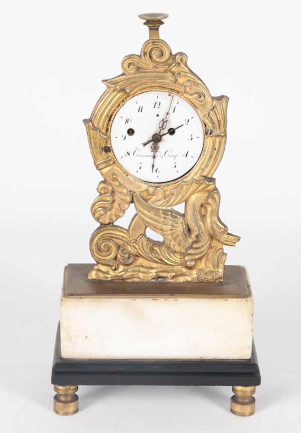 Antique small French Empire period table clock, in gilded bronze, embossed and chiseled, white enamel dial and marble base