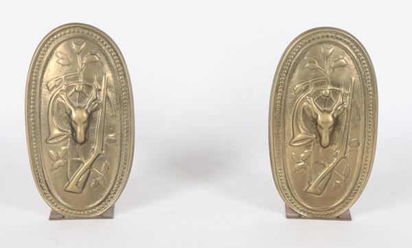 Pair of gilded bronze bookends, embossed and chiseled with hunting motifs