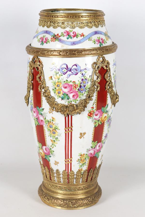 Large French vase in polychrome porcelain from Sèvres, entirely decorated with Louis XVI motifs with gilded and chiseled bronze decorations