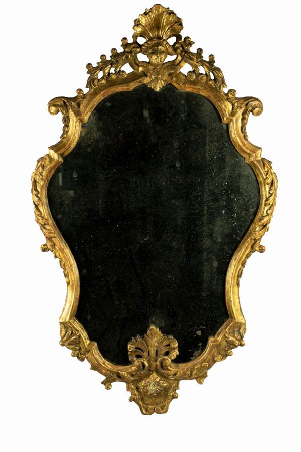 Roman mirror in gilded wood carved with Louis XV motifs