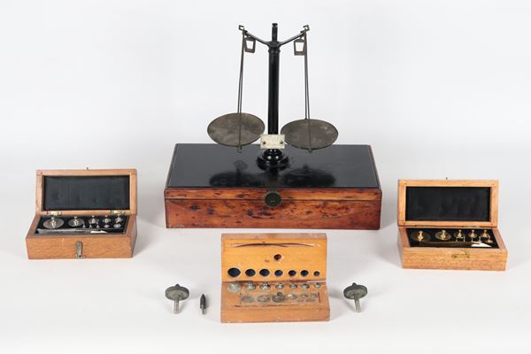 A two-pan brass pharmacy and jeweler's scale with matching weights. Early 1900s. Brand: Società Anonima Bottigelli Milano.