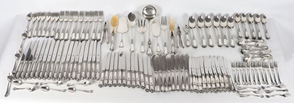 Cutlery set in chiseled and embossed silver with Louis XV motifs (203 pieces), gr. 8970