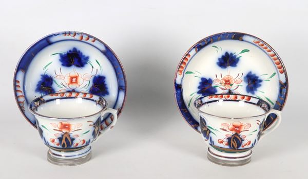 Pair of antique English porcelain cups and saucers, with blue floral decorations  