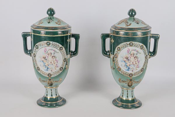 Pair of French potiches in Royal Limoges polychrome porcelain, with decorations of medallions with cherubs and roses and highlights in pure gold