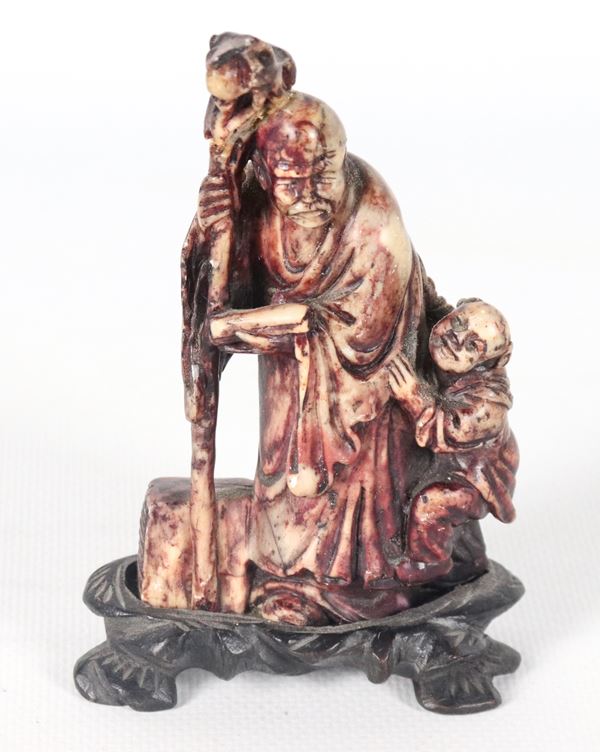  "Holy Man with Child", small Chinese soapstone sculpture with teak base, defects