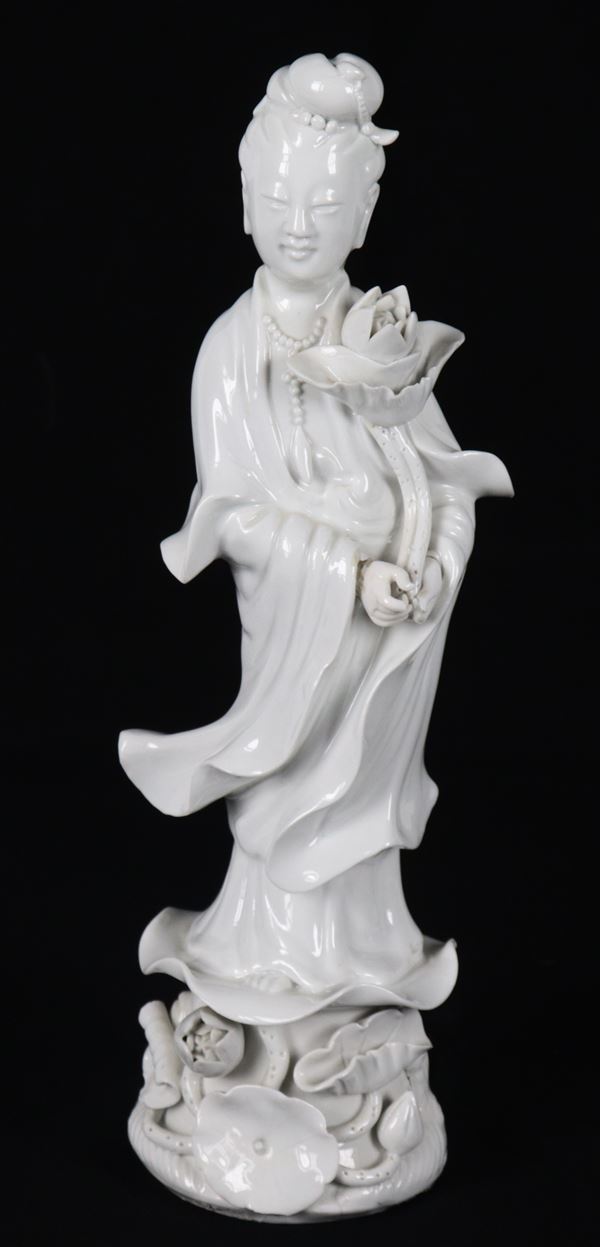 "Guanyin with Rose", a small antique Chinese white porcelain sculpture 