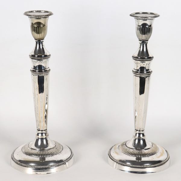 Pair of antique silver-plated candlesticks, chiseled and embossed with Louis XVI motifs
