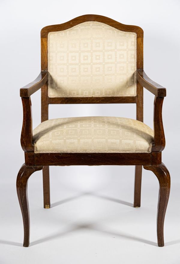 Armchair in walnut with arched back