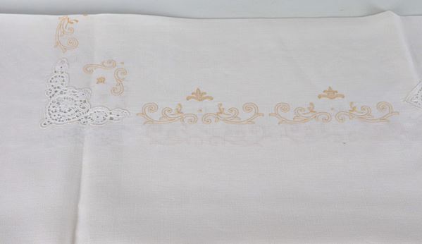 Linen tablecloth with twelve napkins, embroidered with floral motifs and bobbin lace inserts