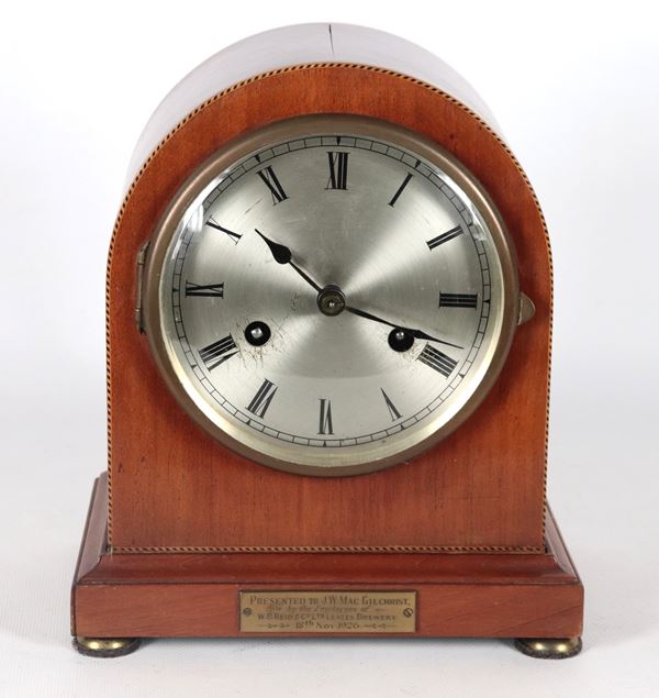 Antique English mahogany table clock with silver-plated dial