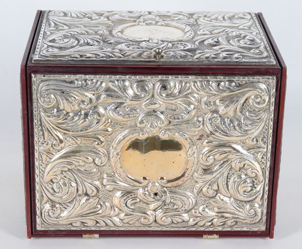 Small wooden chest covered in silver with compartments inside
