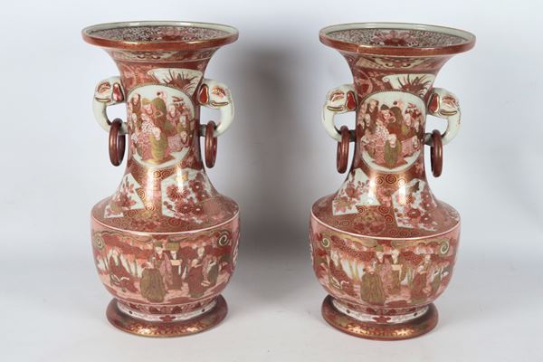 Pair of antique Kutani porcelain vases, entirely decorated with motifs of landscapes, flowers, exotic birds and characters, handles in the shape of elephant heads