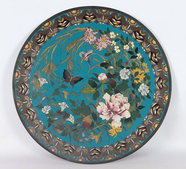 Antique large Chinese bronze plate, entirely covered in polychrome cloisonné enamels with flower and butterfly motifs