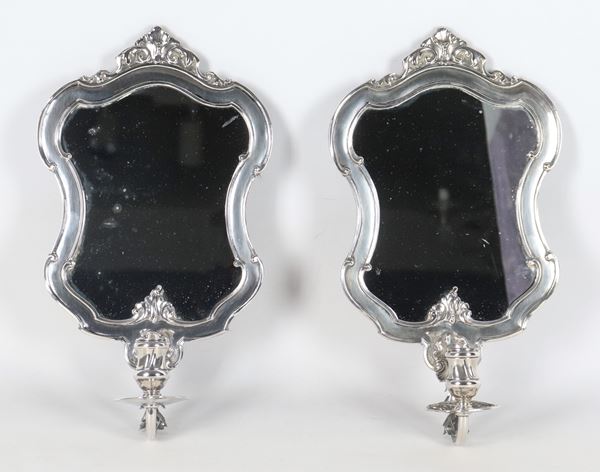Pair of small silver mirrors with candle holders, chiseled and embossed with Louis XV motifs
