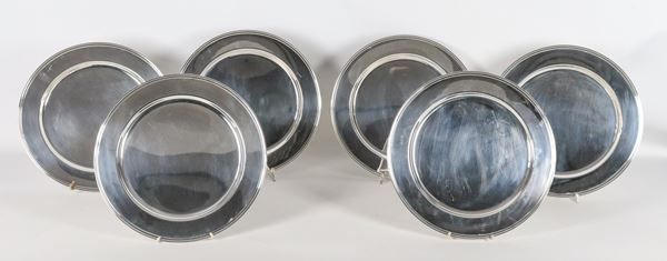 Lot of six round silver-plated metal placemats