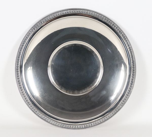 Round silver plate with chiseled and embossed edge with Empire motifs, concave bottom, 410 g