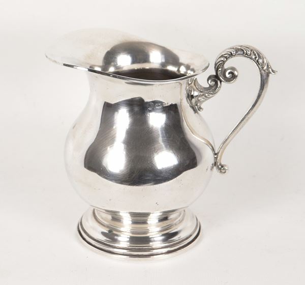 Silver jug with chiseled and embossed handle, 660g