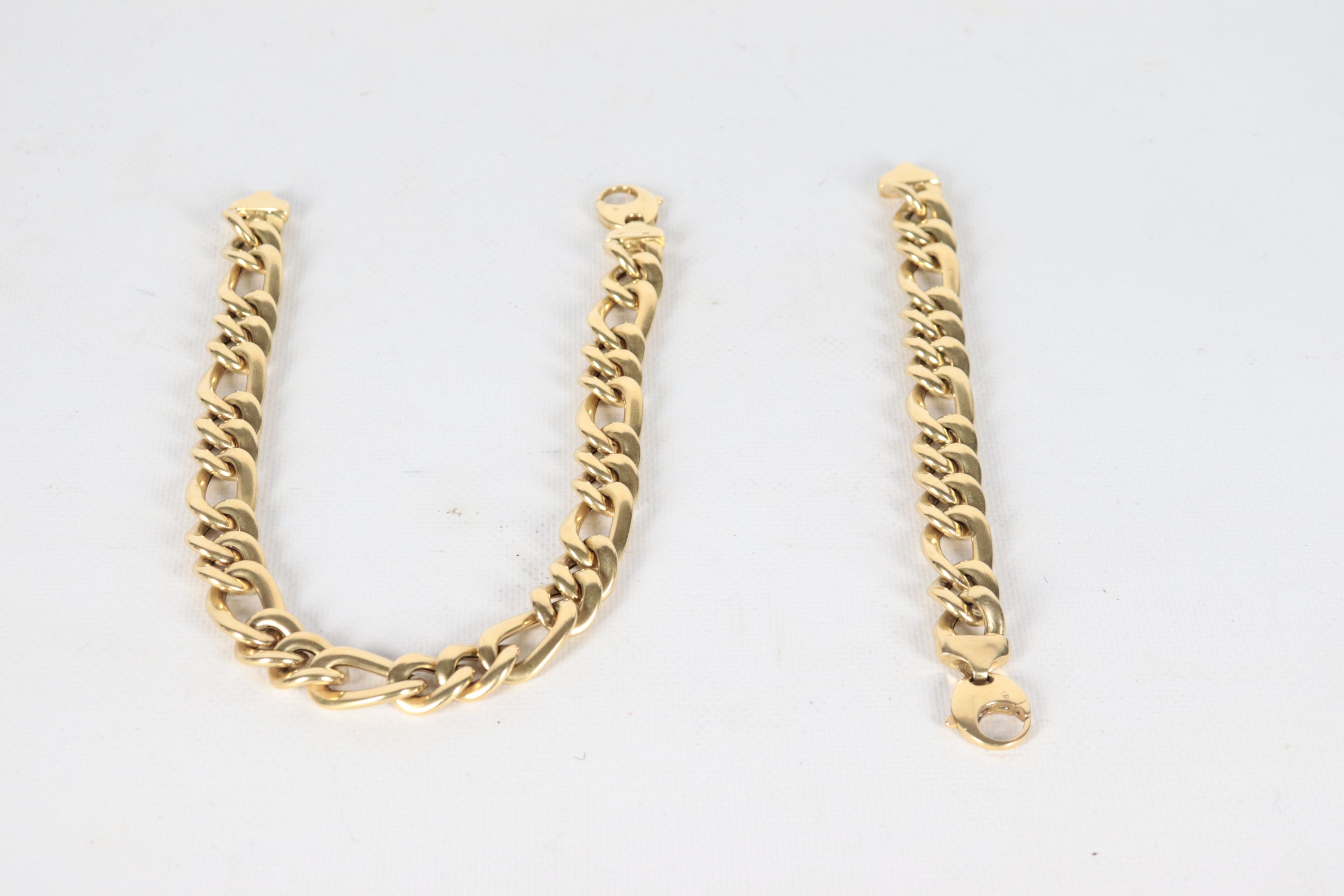 Demi parure in oro giallo 18kt, composta da bracciale e collana girocollo. Peso gr. 127