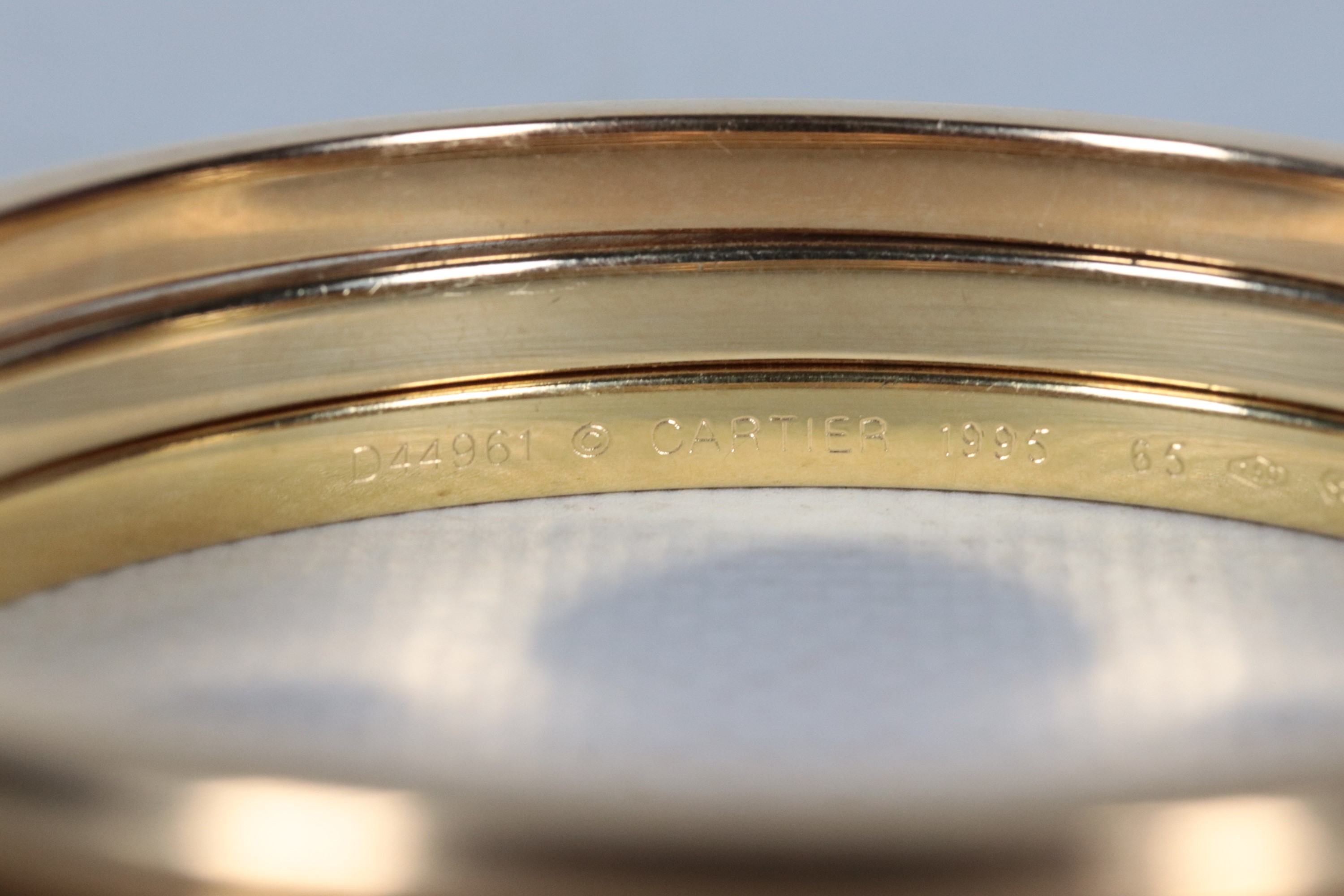 Bracciale in oro giallo 18kt, formato da tre cerchi uniti. Peso gr. 60,5